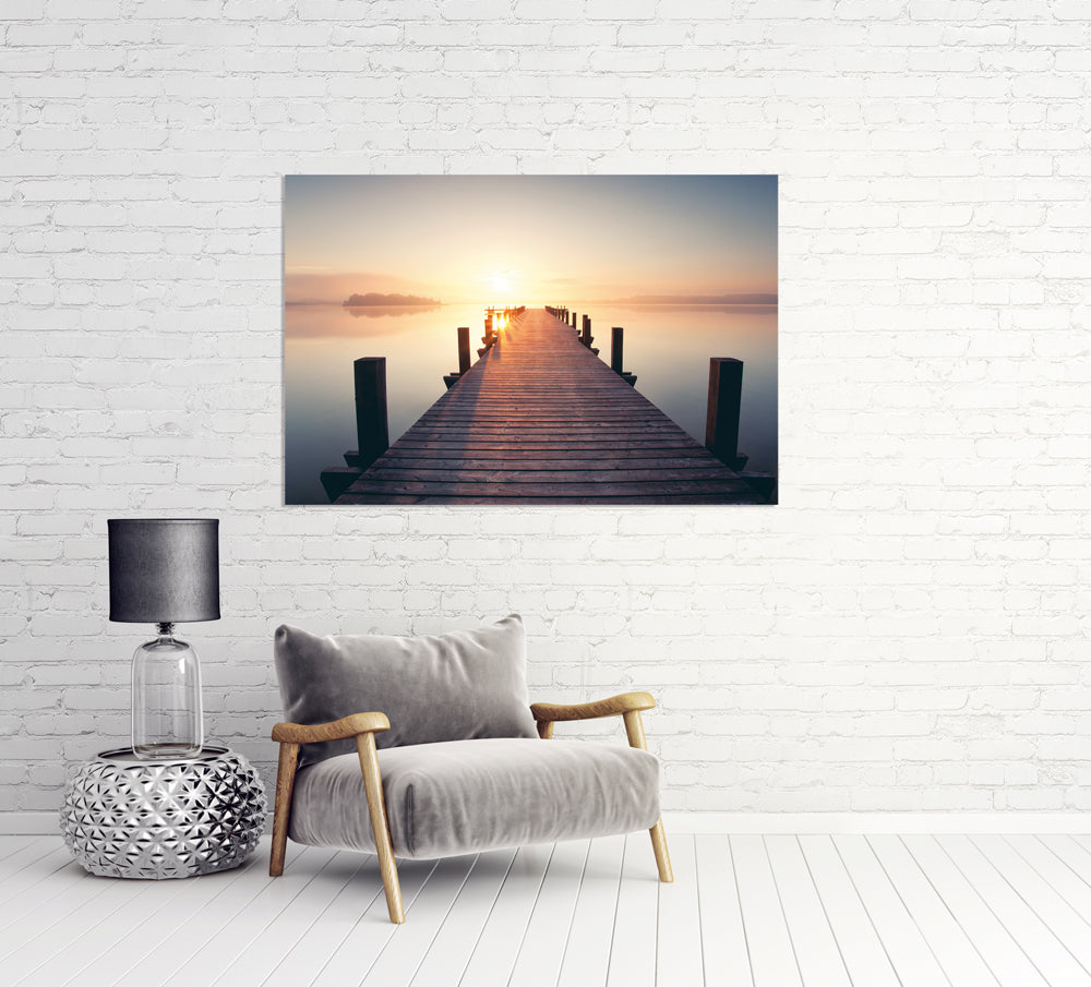 Acrylglasbild Holzsteg in den Sonnenuntergang