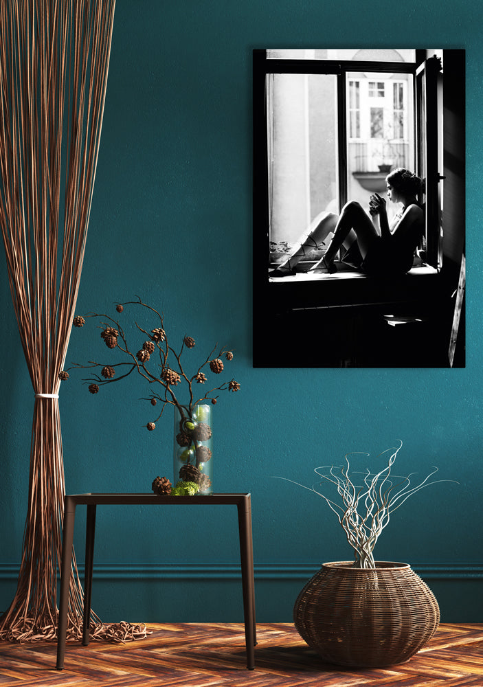 Glass picture Sitting woman on the windowsill
